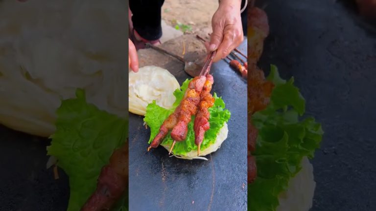 Chinese burger BBQ lamb kebabs on stone slab