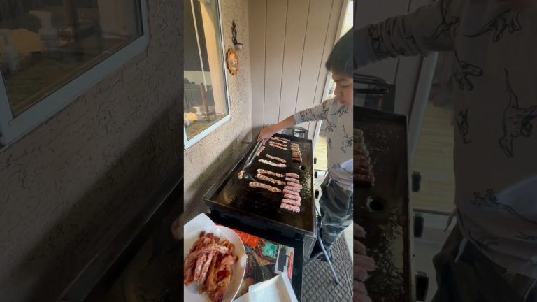 🍳 Captain's breakfast skills are leveling up! Bacon and sausages on the griddle! 🥓 #CaptainAndElle