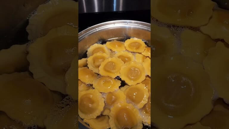 Brown butter ravioli on a steel pan