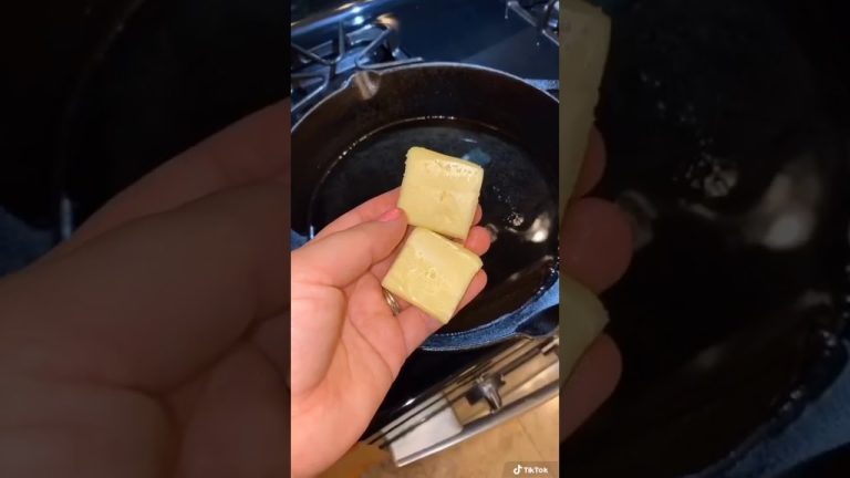 Smothered pork chops in a cast iron skillet