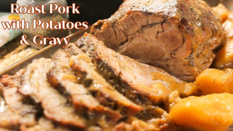 Juicy Tender Savory Roast Pork With Potatoes And Gravy