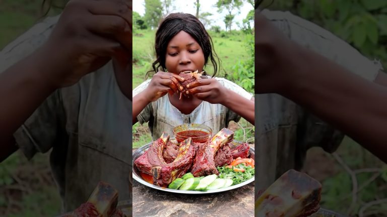 A woman enjoys a feast of giant, saucy BBQ ribs with a side salad outdoors. #asmr #mukbang #shorts